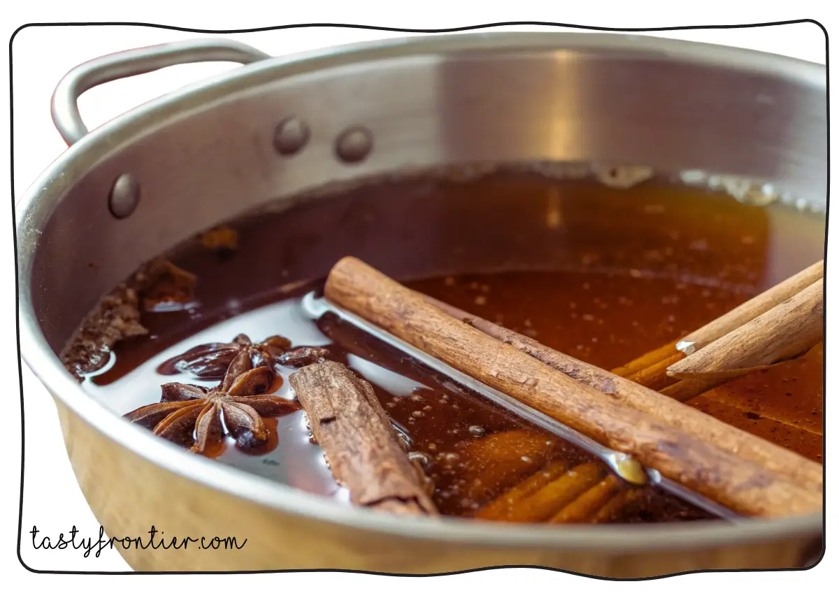 Cinnamon Simple Syrup recipe cooking in a saucepan.